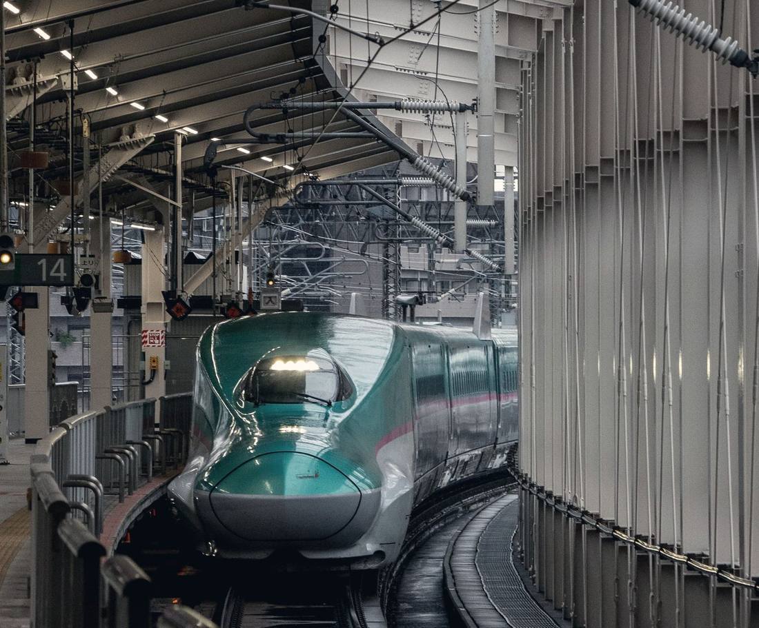 High-speed train pulling into a station platform